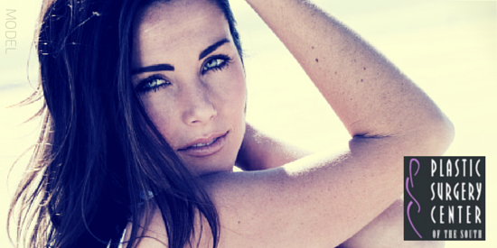 Dark haired young woman looking back over her shoulder