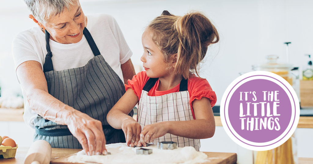 Grandmother making cookies with girl