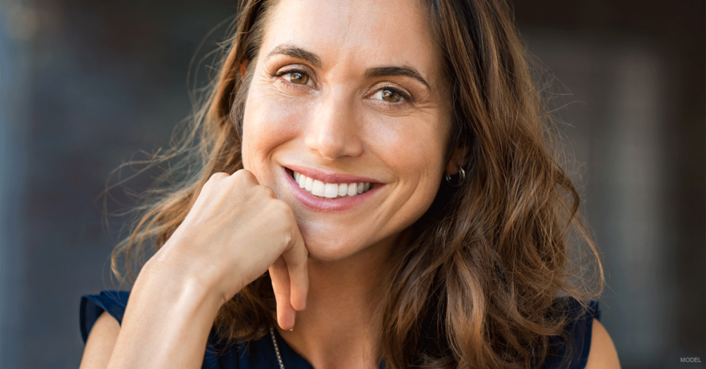 Closeup of smiling woman with dark brown hair