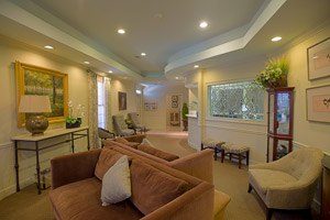 Office interior with yellow walls and comfortable chairs and couches