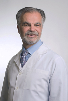 Dr. Petrosky in a white labcoat