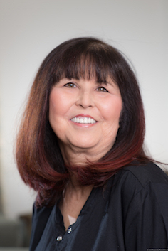 Headshot of Lynda in a black top