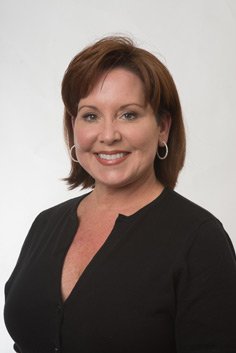 Headshot of Mauri wearing a black top