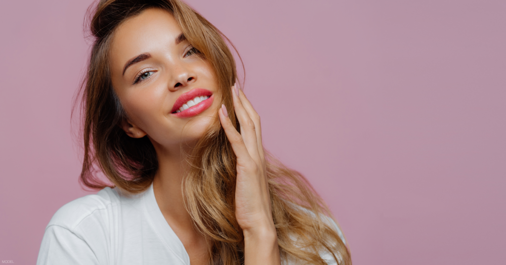 Woman smiling after reading about what to expect during her dermal filler treatment in Marietta, GA.